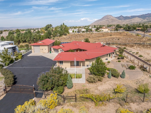 birds eye view of property with a mountain view