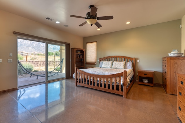 bedroom featuring access to exterior, ceiling fan, and concrete floors