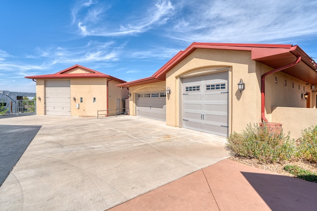 exterior space featuring a garage and an outdoor structure