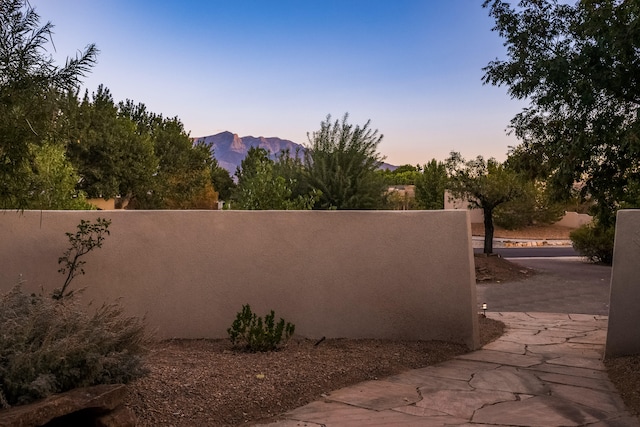 patio terrace at dusk with a mountain view