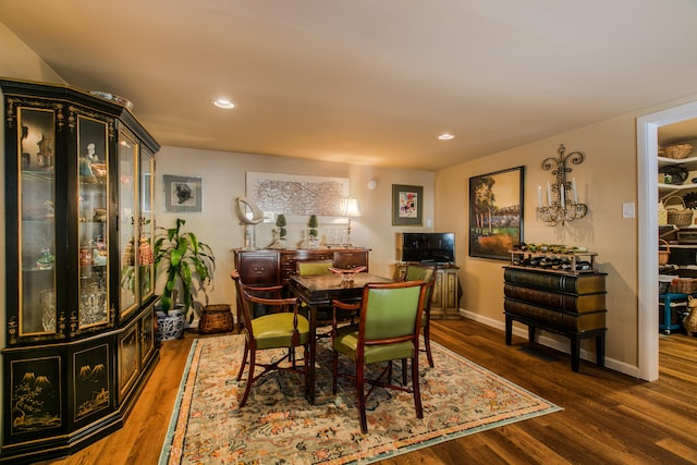 dining space with dark wood-type flooring