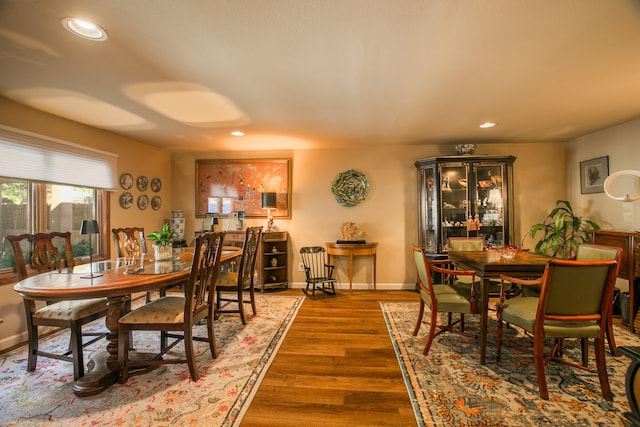 dining area with dark hardwood / wood-style floors