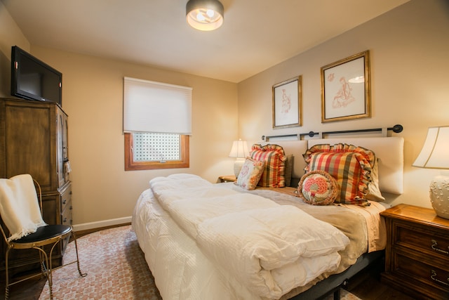 bedroom featuring dark hardwood / wood-style flooring