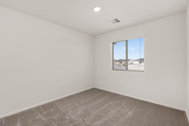 empty room featuring carpet flooring