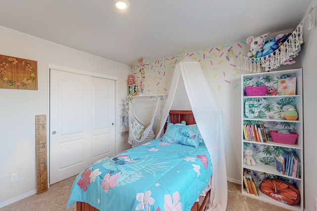 bedroom with a closet and carpet