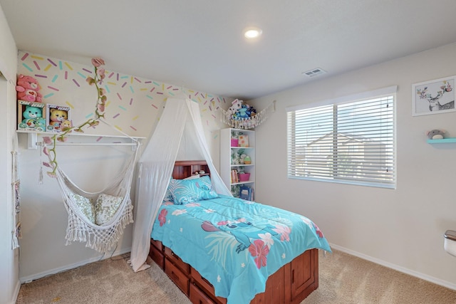 bedroom featuring light carpet