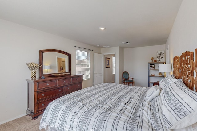 bedroom featuring light colored carpet