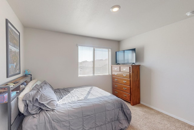 bedroom with light carpet