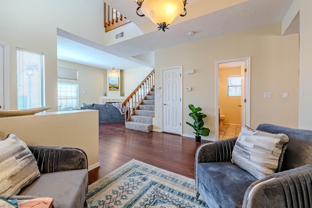 living room with dark hardwood / wood-style flooring