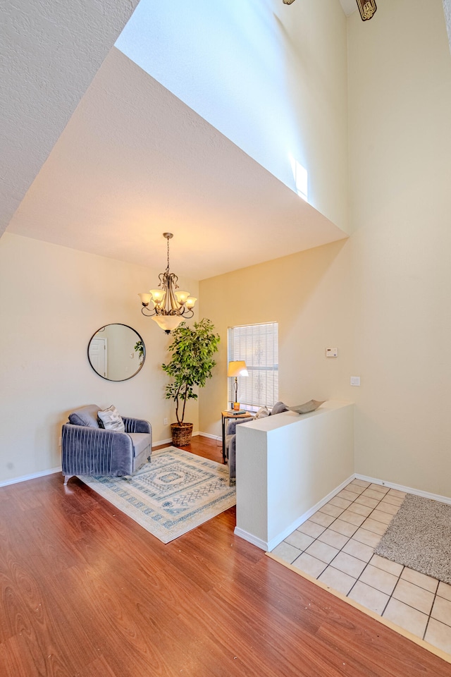 interior space with an inviting chandelier and light hardwood / wood-style flooring