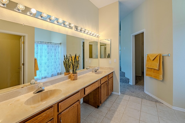 bathroom with tile patterned flooring and vanity