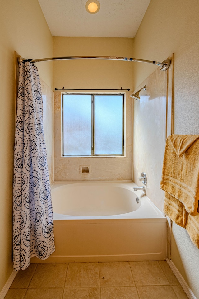 bathroom featuring tile patterned flooring, shower / bath combo, and a healthy amount of sunlight