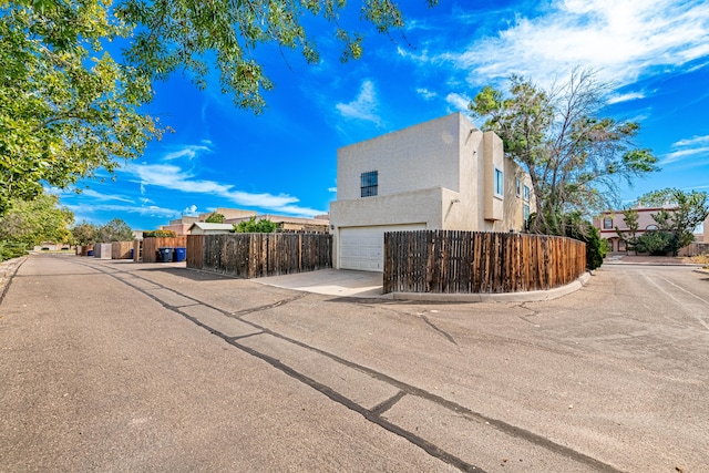 view of side of property with a garage