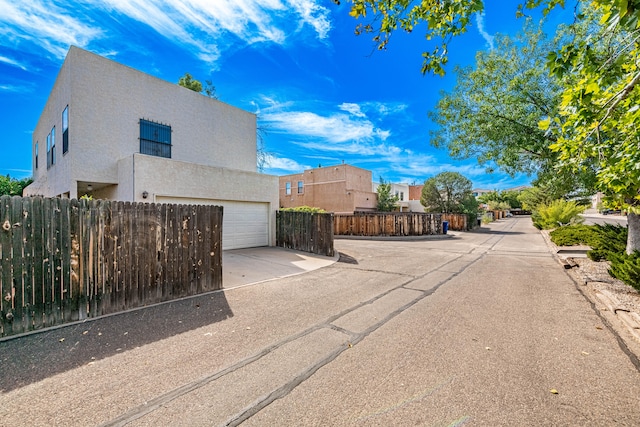 view of side of property with a garage