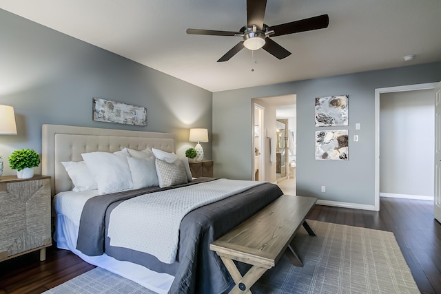 bedroom with ceiling fan, dark hardwood / wood-style floors, and ensuite bathroom