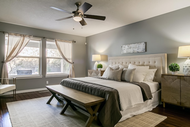 bedroom featuring ceiling fan and dark hardwood / wood-style flooring