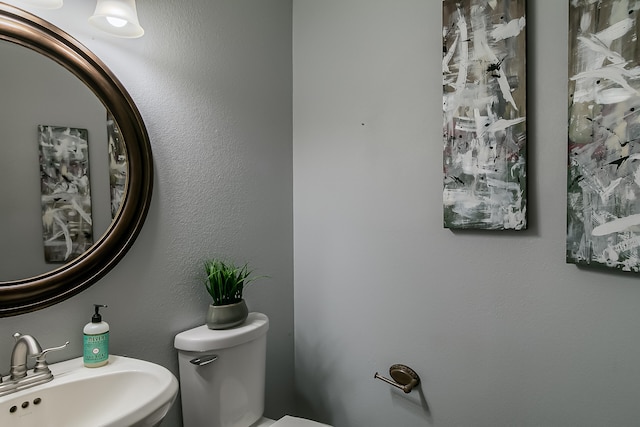 bathroom with toilet and sink