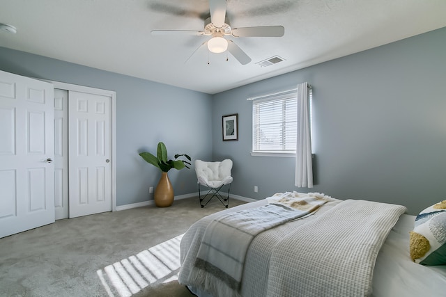 carpeted bedroom with ceiling fan