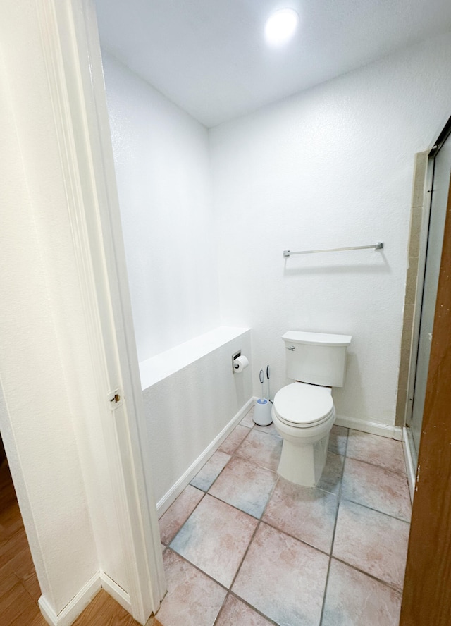 bathroom with tile patterned floors and toilet