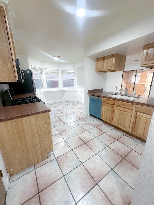 kitchen featuring sink, light tile patterned flooring, and stainless steel appliances