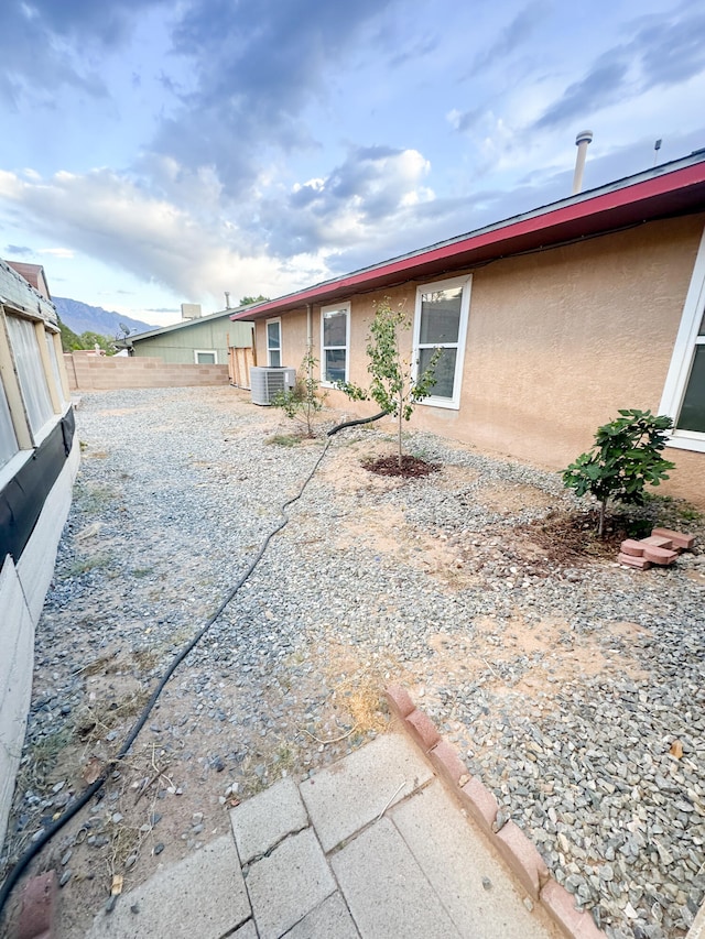 exterior space featuring central AC and a patio area