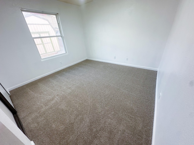 unfurnished room with carpet