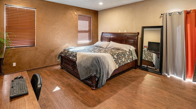 bedroom featuring hardwood / wood-style flooring