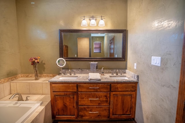 bathroom with a relaxing tiled tub and vanity