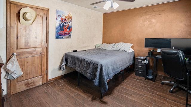 bedroom with ceiling fan and dark hardwood / wood-style flooring