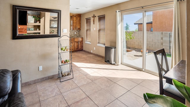 entryway featuring light tile patterned floors