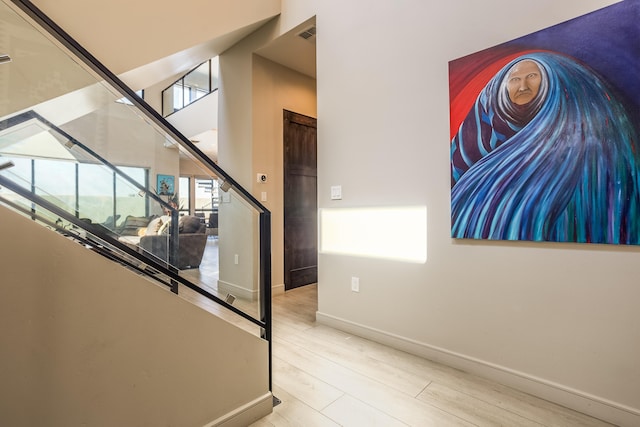 stairs with hardwood / wood-style flooring