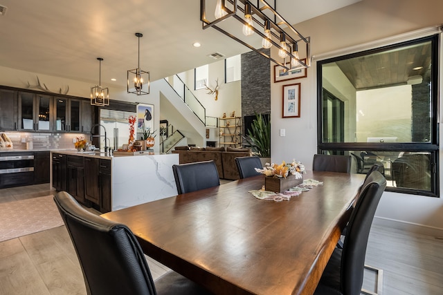 dining space featuring sink and light hardwood / wood-style flooring