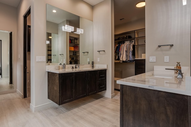 bathroom featuring vanity and hardwood / wood-style flooring