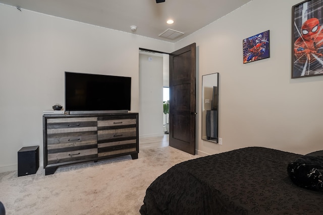 bedroom featuring light colored carpet