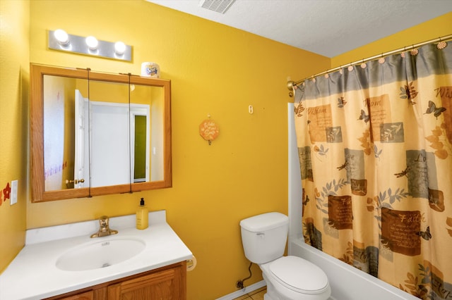 full bathroom with vanity, shower / bath combo, a textured ceiling, and toilet