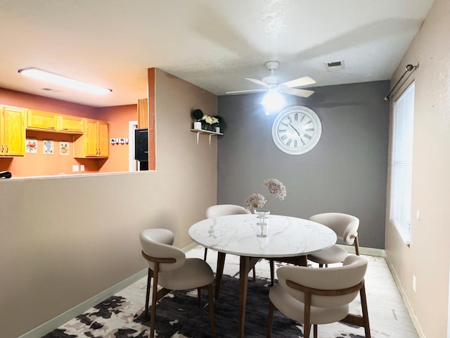 dining room featuring ceiling fan