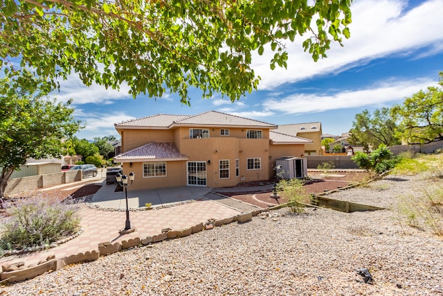 rear view of house featuring a patio