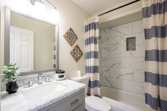 full bathroom with shower / bath combo, vanity, and toilet