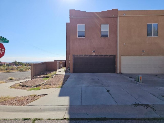 southwest-style home featuring a garage