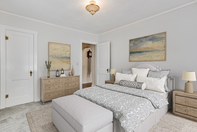 bedroom featuring crown molding and light carpet