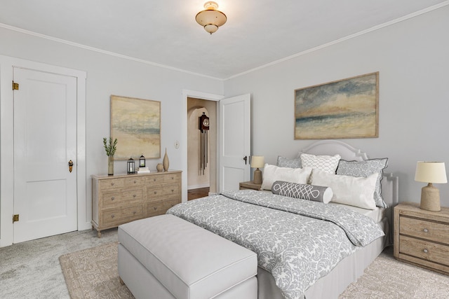 bedroom featuring crown molding and carpet