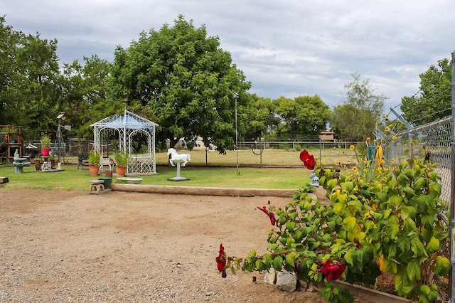 view of property's community featuring a gazebo and a yard