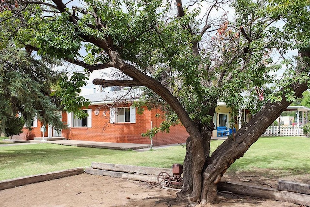 view of home's exterior with a lawn