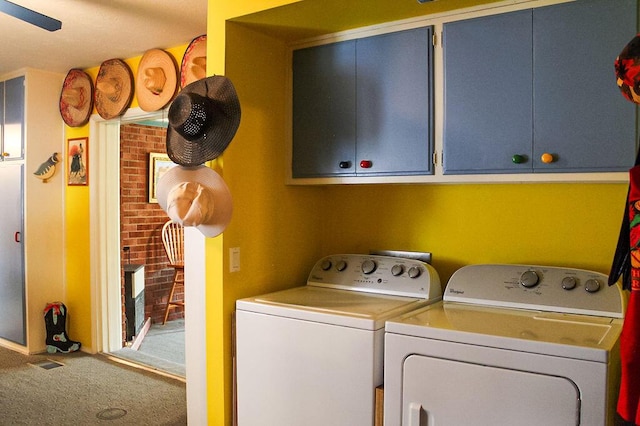 laundry area with cabinets, separate washer and dryer, and carpet floors