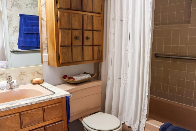 full bathroom featuring toilet, vanity, and shower / bath combo with shower curtain