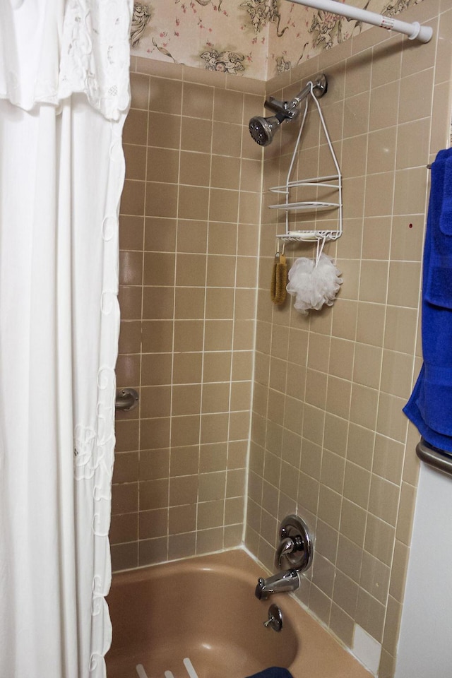 bathroom with shower / bath combination with curtain