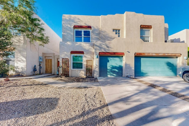 adobe home featuring a garage