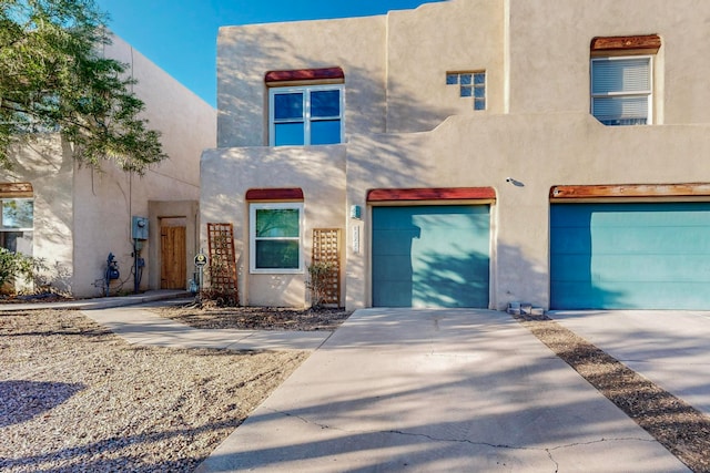 southwest-style home featuring a garage