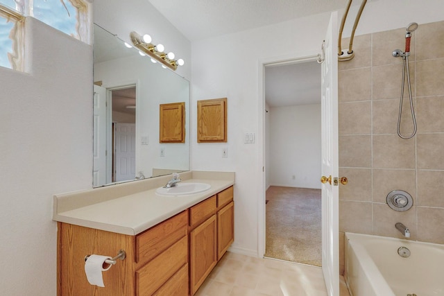 bathroom with vanity and tiled shower / bath combo