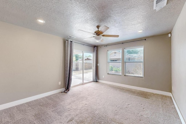 1139 Forrester Ave NW, Albuquerque, NM 87104 - empty room with baseboards, carpet floors, a ceiling fan, and visible vents